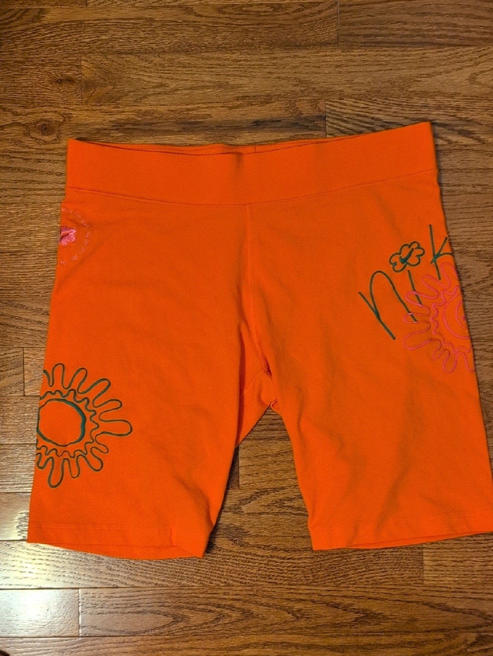 Nike Orange Bike Shorts with Floral Graphics